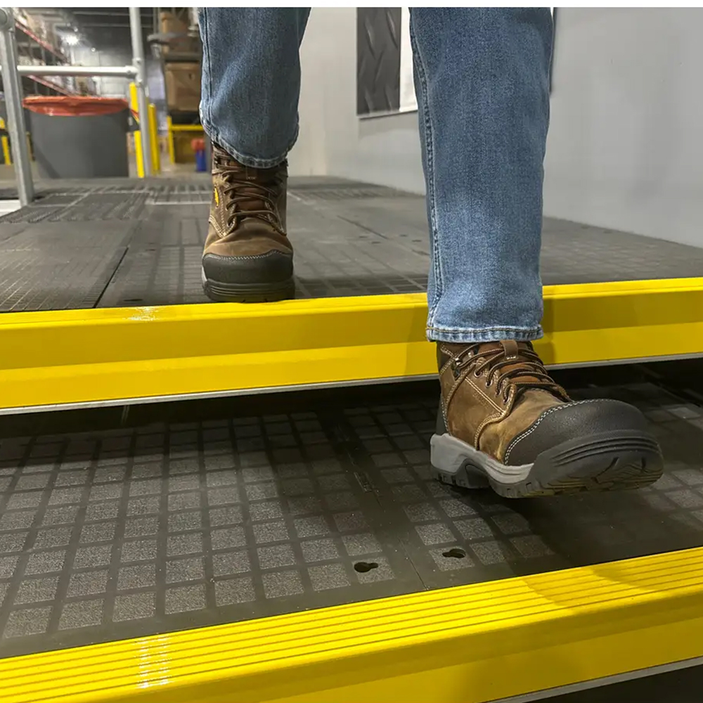 Wearwell Foundation Platform Beam Edge Yellow 2 Inch x 6 Ft. installed on steps