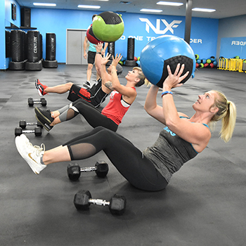 Medicine ball workouts on rubber flooring