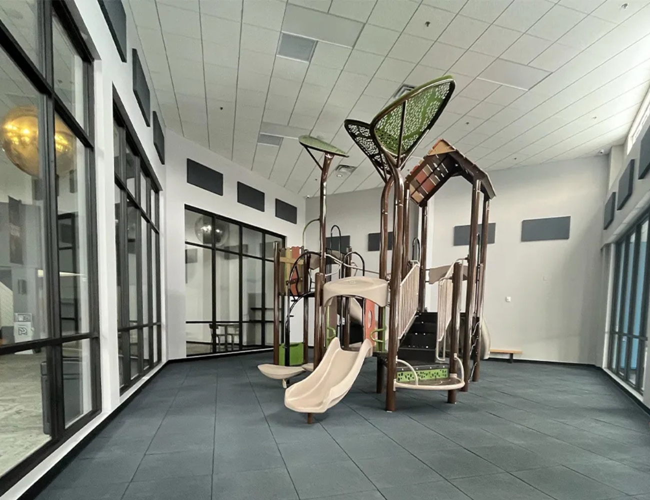 Indoor playground built over rubber tile flooring