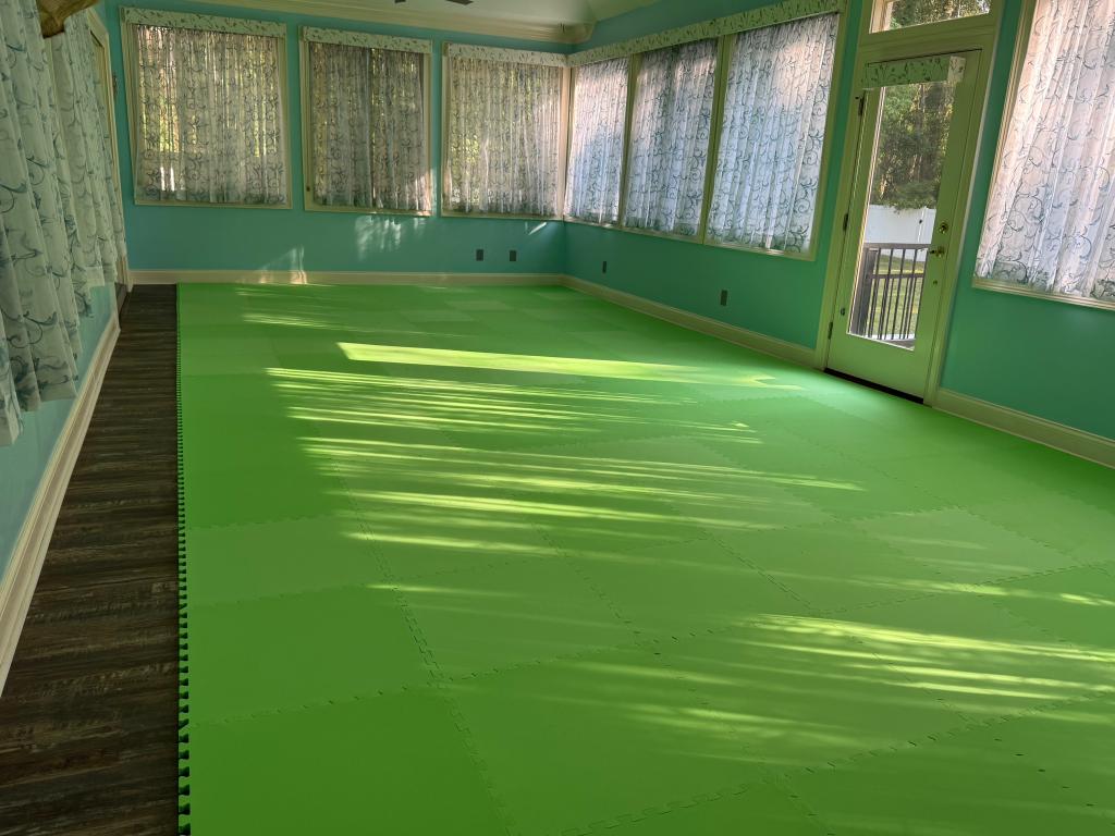 green interlocking foam mats in sunroom