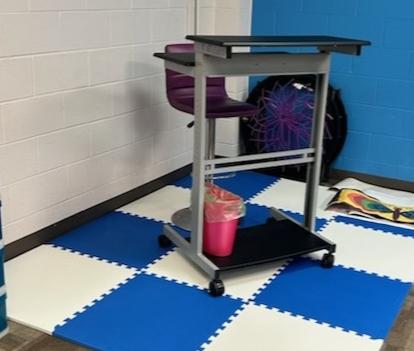 white and blue interlocking foam mats in classroom