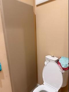 tan wall padding in bathroom