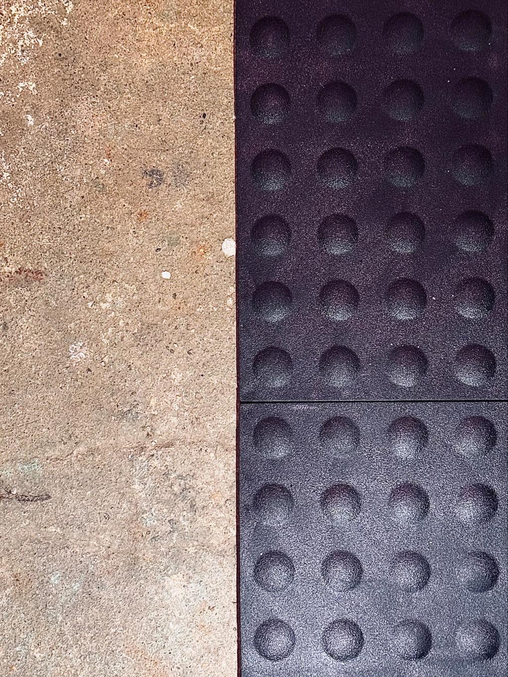 black staylock bump top tiles installed over concrete