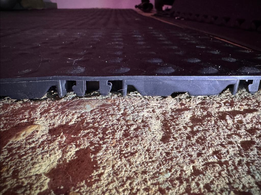 black staylock bump top tiles over basement concrete floor
