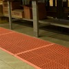 VIP Topdek Senior Red Mat 3 x 14 Feet 8 Inches over concrete next to workshop bench