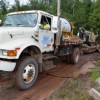 large commercial truck stuck in the mud thumbnail