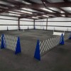 Black interlocking Dog Agility Mats in course for pole weaving
