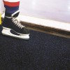 HatTrick close up of Blade Rolled Rubber 9 mm x 4 Ft. Wide Per SF with ice skates
