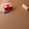 Sandstone G-Floor Ribbed Tread Vinyl Multipurpose Roll 55 mil x 5x10 Ft. with carpenter tools