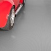 G-Floor Ribbed Tread Garage Floor Roll 55 Mil x 8.6x24 Ft. with red car parked on slate gray