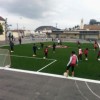 kicks playing soccer on all sport artificial turf grass outdoors