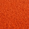 close up of orange colored baseball home plate mat