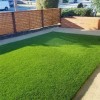 Sunny Sod Artificial Turf Roll 1-1/2 Inch x 15 Ft. Wide Per SF Home with fence