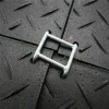 connector connecting four black ground protection mats