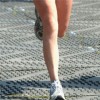 person running on liberty ground protection mats