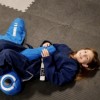 Home MMA BJJ Mats 2x2 Ft showing child and grappling dummy