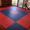 interlocking red and blue installation of bjj grappling puzzle mats