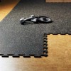 Weights on Rubber Tile Interlocking Sport West 10% Light Gray 3/8 Inch x 2x2 Ft.