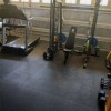 interlocking rubber tiles in garage gym with workout equipment