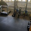 interlocking rubber tiles in garage gym with workout equipment