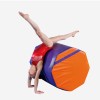 gymnast practicing on purple and orange octagon mat