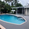 gray Outdoor Interlocking Patio Tiles Flooring around a pool deck