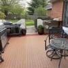 tan and terra cotta interlocking Patio Outdoor Tiles installed in patio with grills