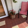 terra cotta and tan outdoor tiles over wood deck