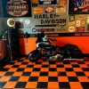 RaceDeck Diamond Garage Floor Tile 1/2 Inch x 1x1 Ft. black and orange tile with motorcycle