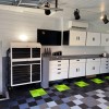garage workshop with RaceDeck Free-Flow Garage tiles installed in the colors black, sublime green, and gray