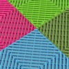 RaceDeck Free-Flow Garage Floor Tile 1/2 Inch x 1x1 Ft. in Neon Pink, Green Light, Sublime and Cool Blue