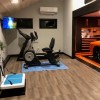Exercise room with RaceDeck Oak Garage Floor Tiles 1/2 Inch x 18x18 Inches