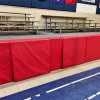 red stage pads used in school gym fastened with velcro