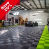 Detailing shopt with RaceDeck Free-Flow Garage Floor Tile 1/2 Inch x 1x1 Ft. in black and sublime