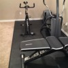 Staylock Bump Top Flooring over carpet with Exercise Equipment on top