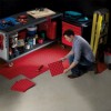 TechFloor Standard with Raised Squares Floor Tile being installed in workshop