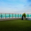 rooftop deck in city with artificial turf flooring