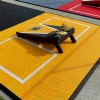 VersaCourt Active Outdoor Court Tile 5/8 Inch 15.75x15.75 Inches close up yellow tile cornhole board