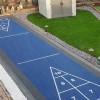 outdoor court foundation panel installed for shuffleboard court with court tiles over the top