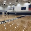 Navy blue wall pads in gym of Safety Fire Rated Impact Wall Pad 2 Inch x 2x7 Ft. Lip TB