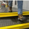 Wearwell Foundation Platform Beam Edge Yellow 2 Inch x 6 Ft. installed on steps