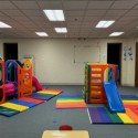 early childhood center with gym mats before installing new playground mats