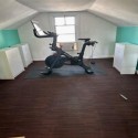 wood grain foam tiles under exercise bike