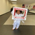 child with martial arts mats