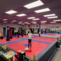 red and blue grappling mma mats in studio
