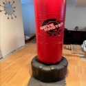 max tiles in basement with punching bag for exercise