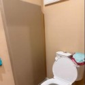 tan wall padding in bathroom