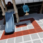 budget friendly playground flooring tiles over top of patio pavers thumbnail