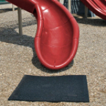 Rubber playground mats are designed for under slides and swing sets.