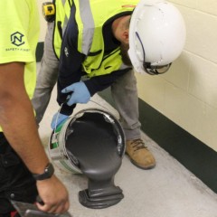 EGrip III Adhesive 4 Gal Pail being poured onto subfloor